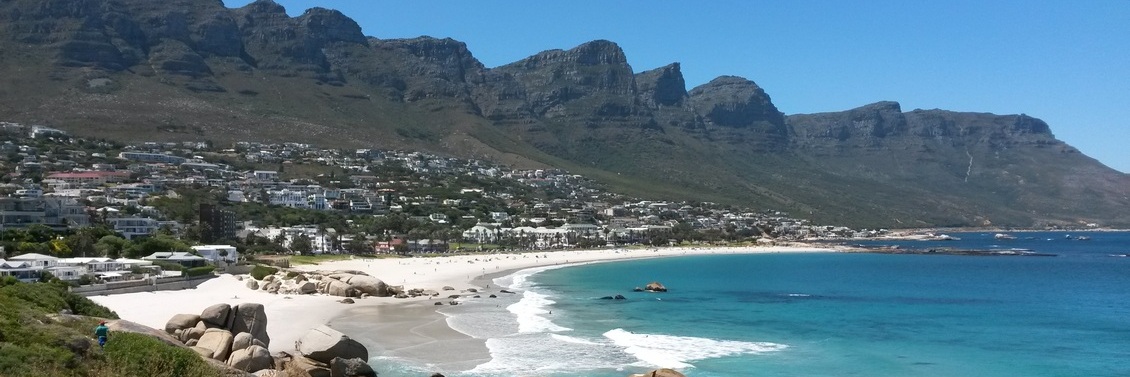 Twelve Apostles Mountain Range from Camps Bay beach on the cape-town-garden-route-tour